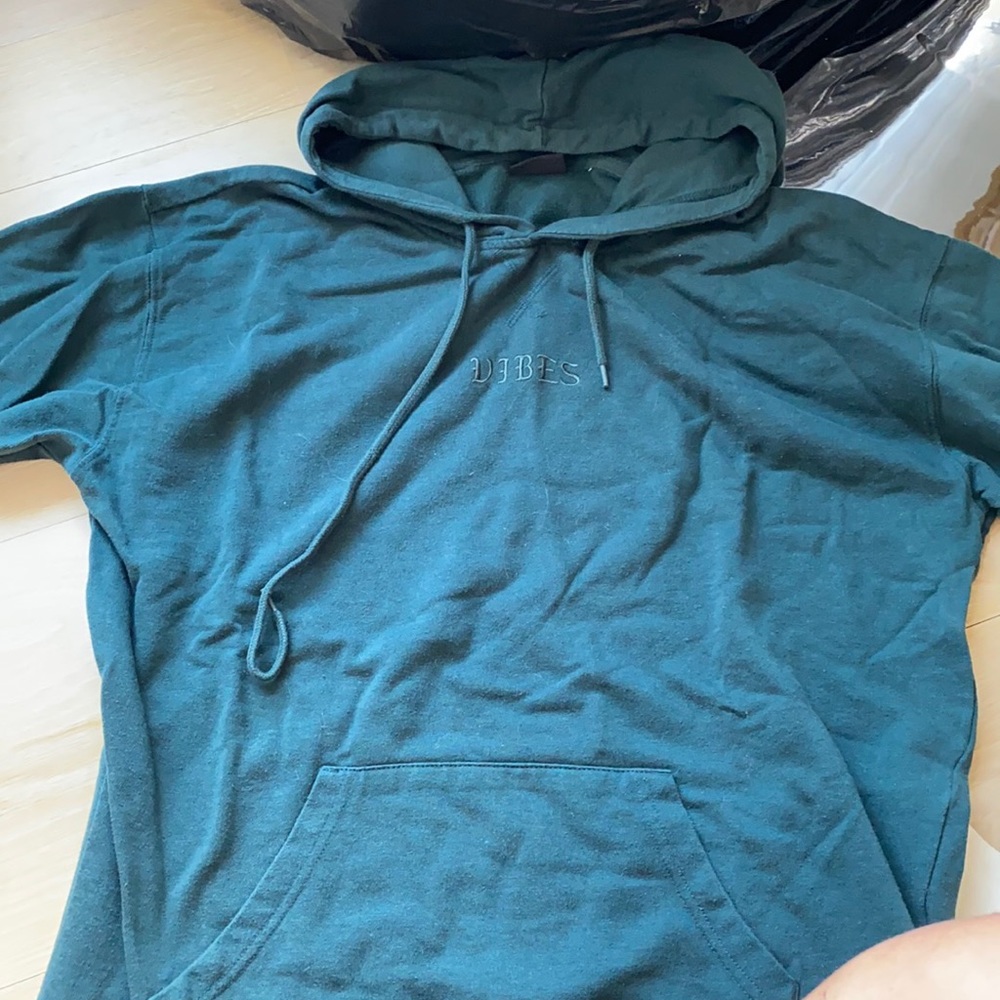 Green sweatshirt that says vibes